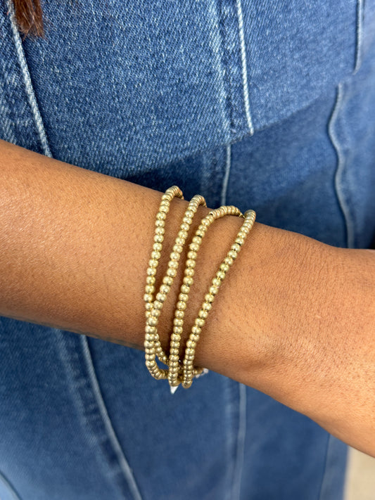 Worn Gold Beaded Stack Bracelets